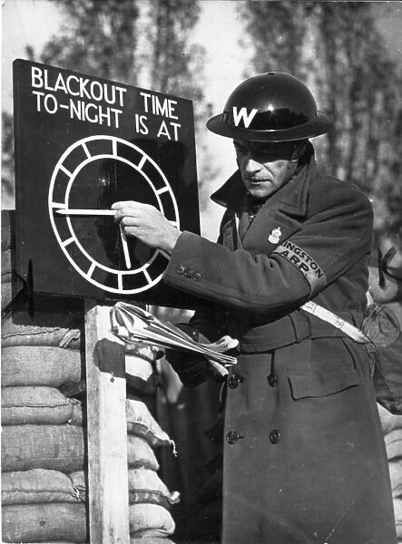 An Air Raid Warden adjusts the Blackout Time indicator