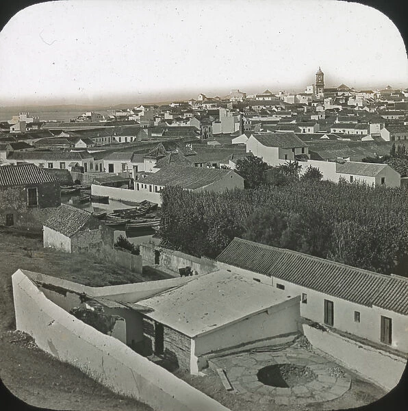 Alqesivas - Black and white view over low houses, spire right background Date: circa 1890s