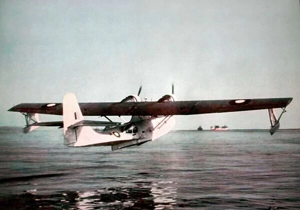 Consolidated PBY Catalina (aft) climbing away of Boein