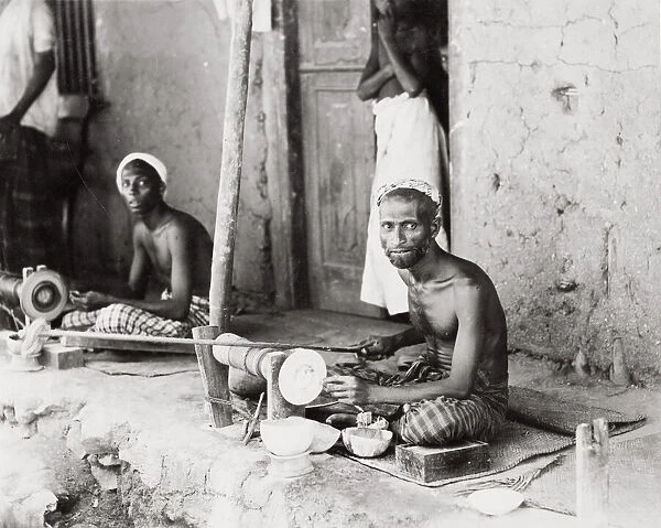 Craftsmen, wood turners at work on lathes, India
