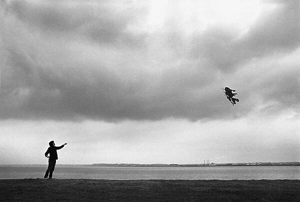 Flying a Chinese kite on the banks of the River Mersey