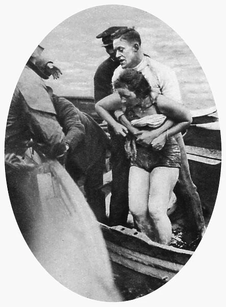 Mercedes Gleitze, swimmer, pulled from the water