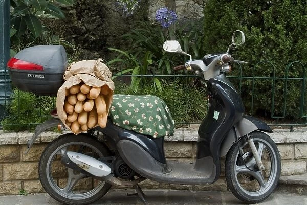 Baguettes on back on scooter, Monaco, Europe