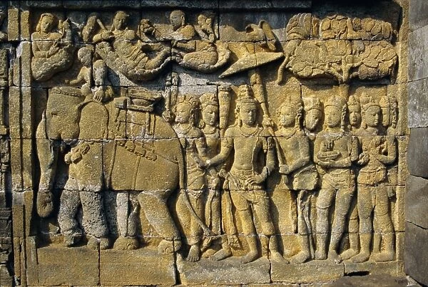 Relief carvings on frieze on outside wall of the Buddhist temple