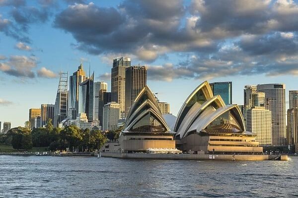 The Sydney Opera House, UNESCO World Heritage Site, and skyline of Sydney at sunset