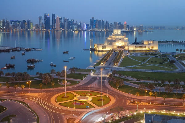 Qatar, Doha, Traffic at roundabout infont of the Museum of Islamic Art at night