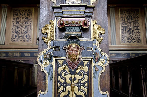 Denmark, Helsingoer. Kronborg Castle (aka Kronborg Slot). Ornate carved wooden chruch pew