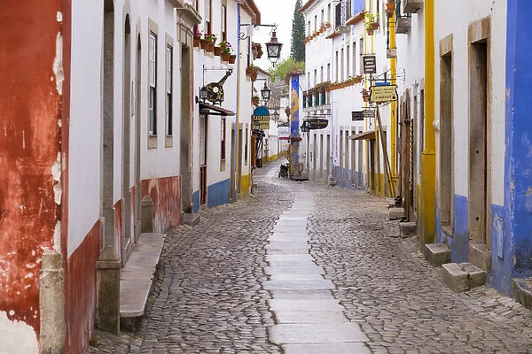 Portugal, Obidos. Leira District. Cobblestone walkways narrow neighborhood streets