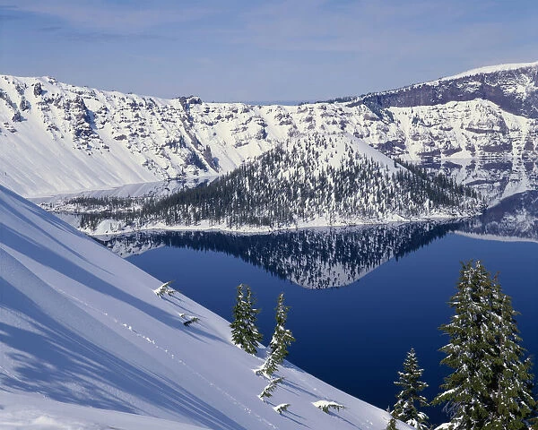 USA, Oregon, Crater Lake National Park. Winter snow on west rim of Crater Lake and Wizard Island