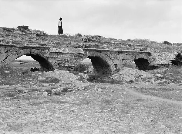 PALESTINE: ROMAN AQUEDUCT. Ancient Roman aqueduct at Caesarea, Palestine. Photograph