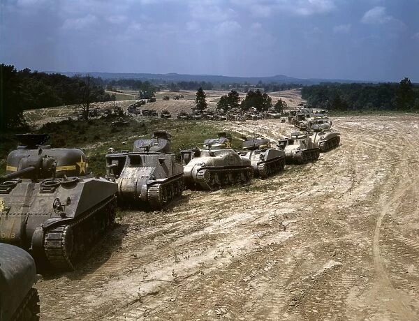 Parade of M-4 Sherman and M-3 Grant tanks during training maneuvers at Fort Knox, Kentucky. Photograph by Alfred T. Palmer, June 1942