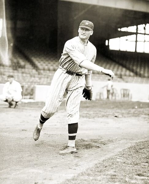 WALTER PERRY JOHNSON (1887-1946). American baseball player. Pitching in 1924