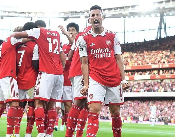 Arsenal's Double Strike: Martinelli & Saka Celebrate against Liverpool in the Premier League (2022-23)