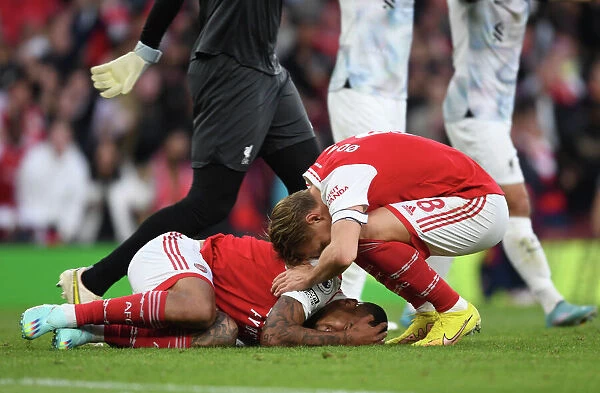 Arsenal's Martin Odegaard Comforts Injured Gabriel Jesus during Arsenal vs Liverpool (2022-23)