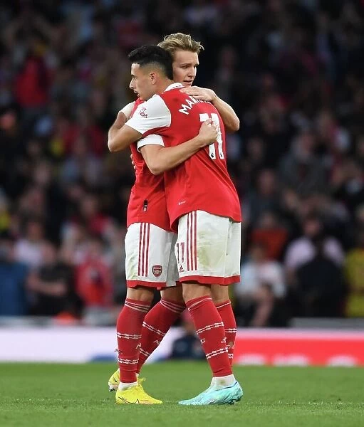 Arsenal's Martin Odegaard and Gabriel Martinelli in Action: A Premier League Rivalry - Arsenal vs. Liverpool (2022-23)