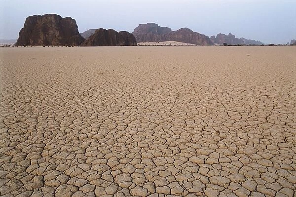 Chad, Ennedi Massif, cracked dried earth in desert