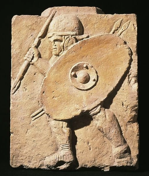 Column base with relief portraying legionnaire armed with pilum and with round helmet and oval shield, from Mainz, Germany