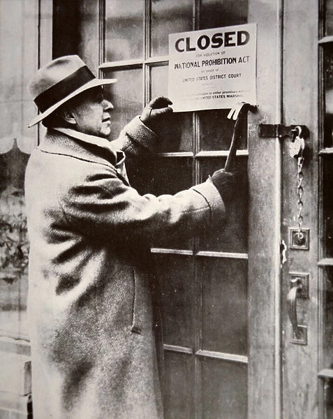 A US Federal Agent closing a saloon during the American Prohibition (1920-33) (b  /  w photo)