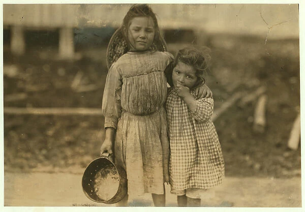 Maud and Grade Daly, 5 and 3 years old pick about a pot of shrimp each day for the