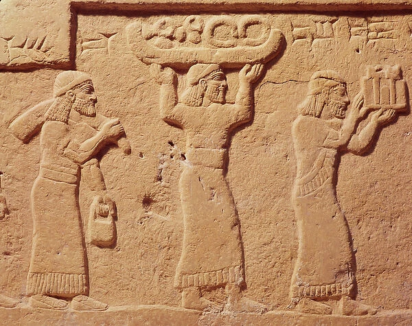 Relief depicting porters laden with gifts (stone)