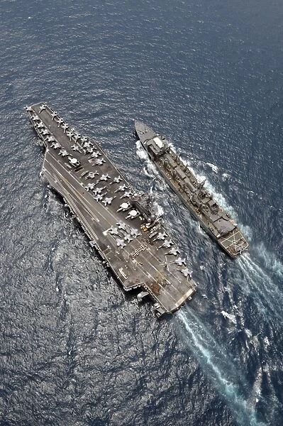 Aerial view of aircraft carrier USS Ronald Reagan and USNS Bridge during a replenishment