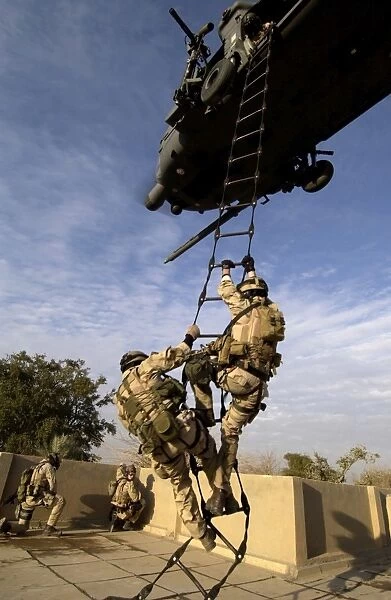 Air Force pararescuemen are extracted by an HH-60G Pave Hawk helicopter