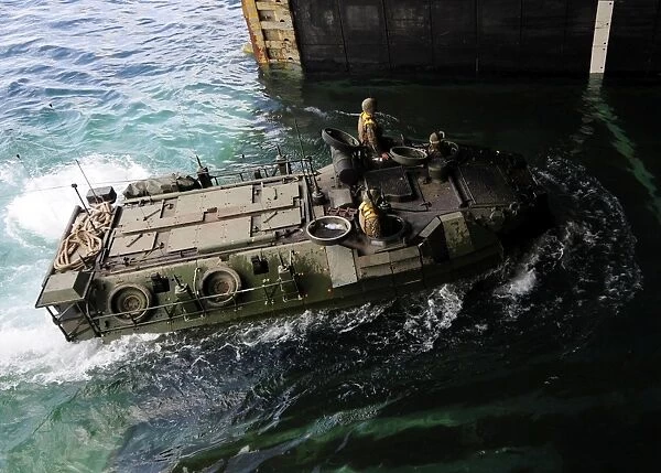 An amphibious assault vehicle enters the well deck of USS Germantown