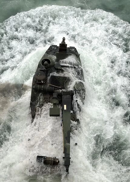 An amphibious assault vehicle leaves the well deck of USS Iwo Jima