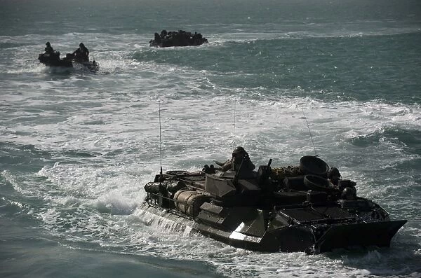 Amphibious assault vehicles transit the Arabian Gulf