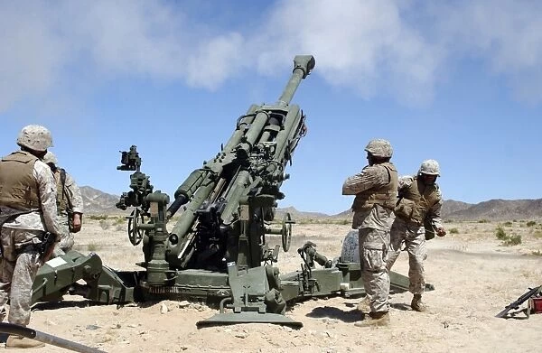 Artillerymen fire-off a round with the M777 Lightweight 155-millimeter Howitzer