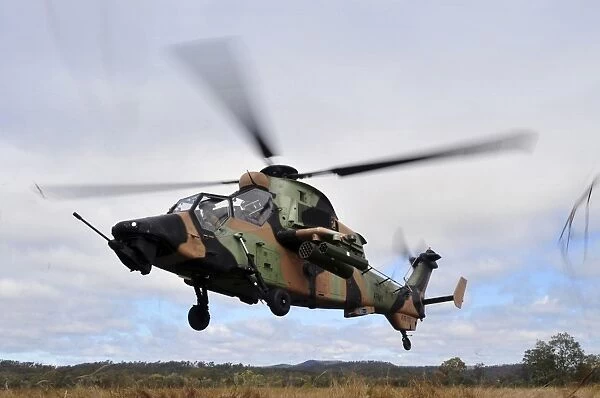 An Australian Army Tiger helicopter flies a reconnaissance mission