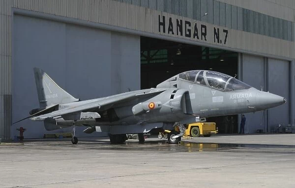 An AV-8B Harrier II of the Spanish Navy parked in front of the hangar bay