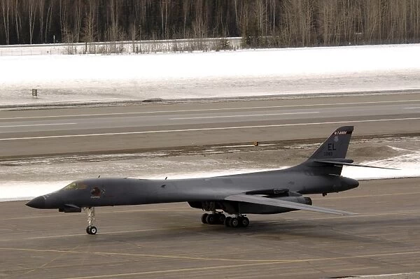 A B-1B Lancer performs a touch and go before landing