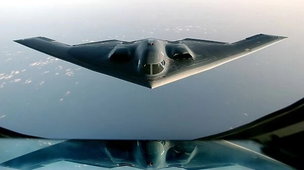 A B-2 Spirit takes on fuel from a KC-135 Stratotanker