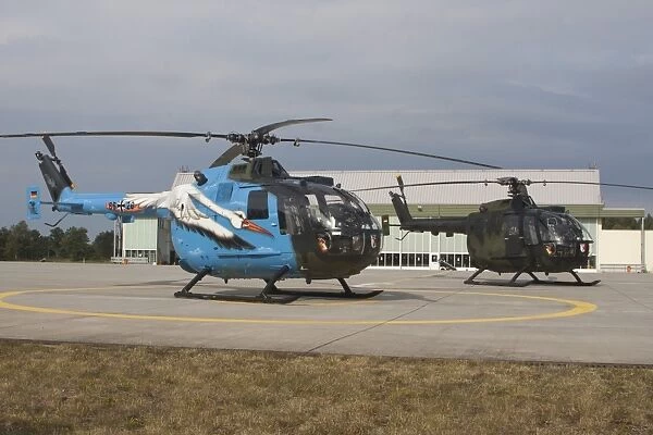 A Bo-105 liaison helicopter and a NH90 of the German Armed Forces