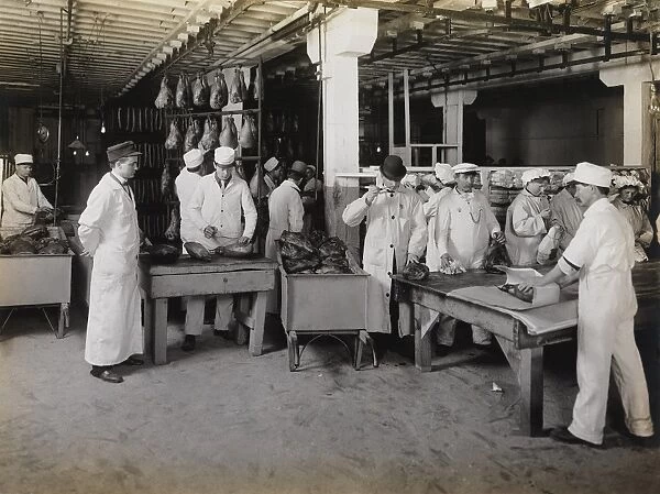 Branding smoked hams at the meat packing establishments, 1910