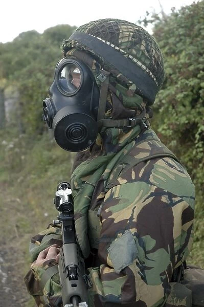 British soldier in full NBC protection gear and a S6 respirator