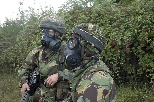 British soldiers in full NBC protection gear and a S6 respirator