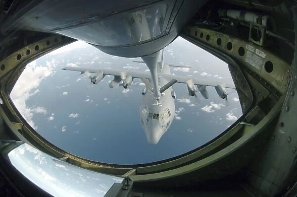A C-130 Hercules is refueled by a KC-135 Stratotanker