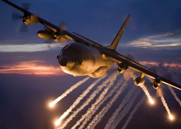 A C-130 Hercules releases flares during a mission over Kansas