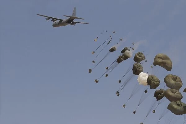A C-130J Shimshon of the Israeli Air Force performs a low level supply drop