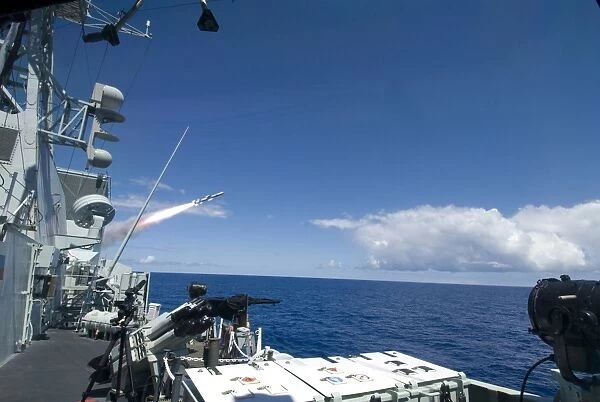 The Canadian frigate HMCS Regina firing a Harpoon anti-ship missile during a Rim