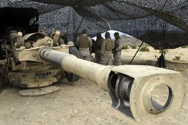 Cannoneers take advantage of some down time behind their M198 Towed Howitzer