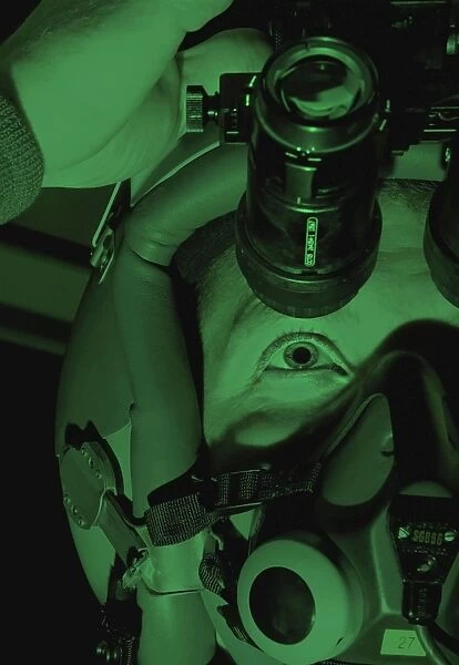 Captain tests his night vision goggles before a night sortie