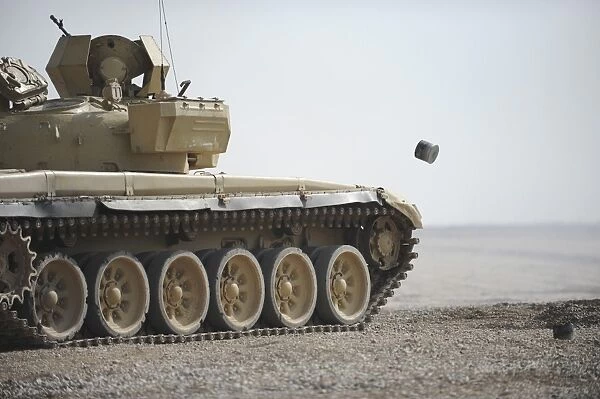 Empty casings eject from an Iraqi T-72 tank on the firing range