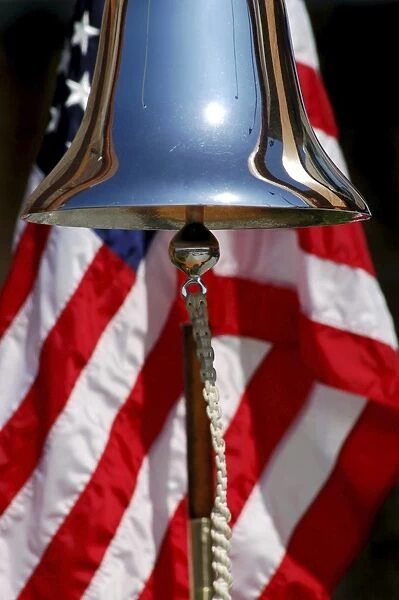 A ceremonial ships bell displayed during a dedication ceremony