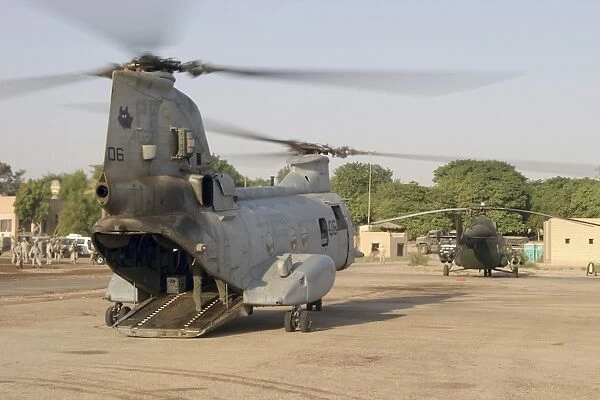A CH-46 Sea Knight and Mi-8 helicopter at Al Kut, Iraq