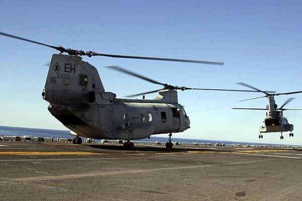 CH-46E Sea Knight helicopters practice vertical replenishments aboard USS Bataan