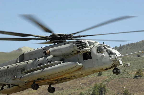 A CH-53 Super Stallion helicopter lands at the Mountain Warfare Training Center in