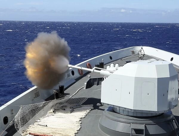 Chinese Navy multi-role frigate Hengshui fires its main gun